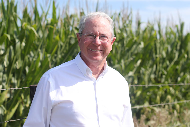 Portrait of Mark Gannon standing in front of a corn field