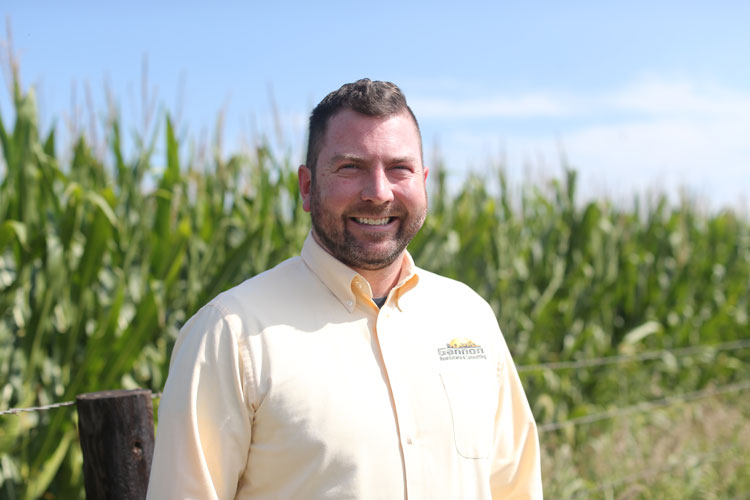 Portrait of Patrick Gannon standing in front of a corn field